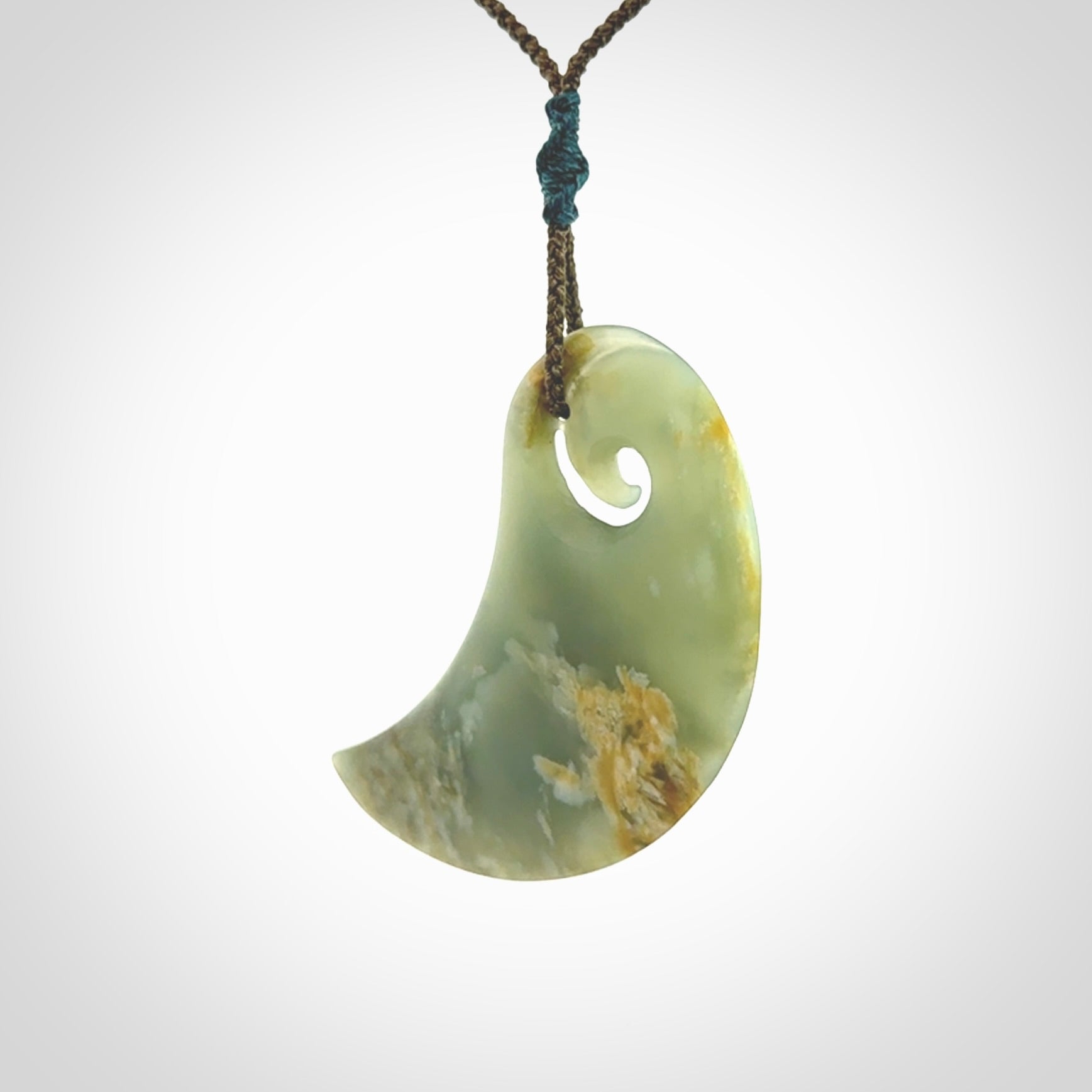 Beautifully Carved Koru drop pendant in delightful Jade