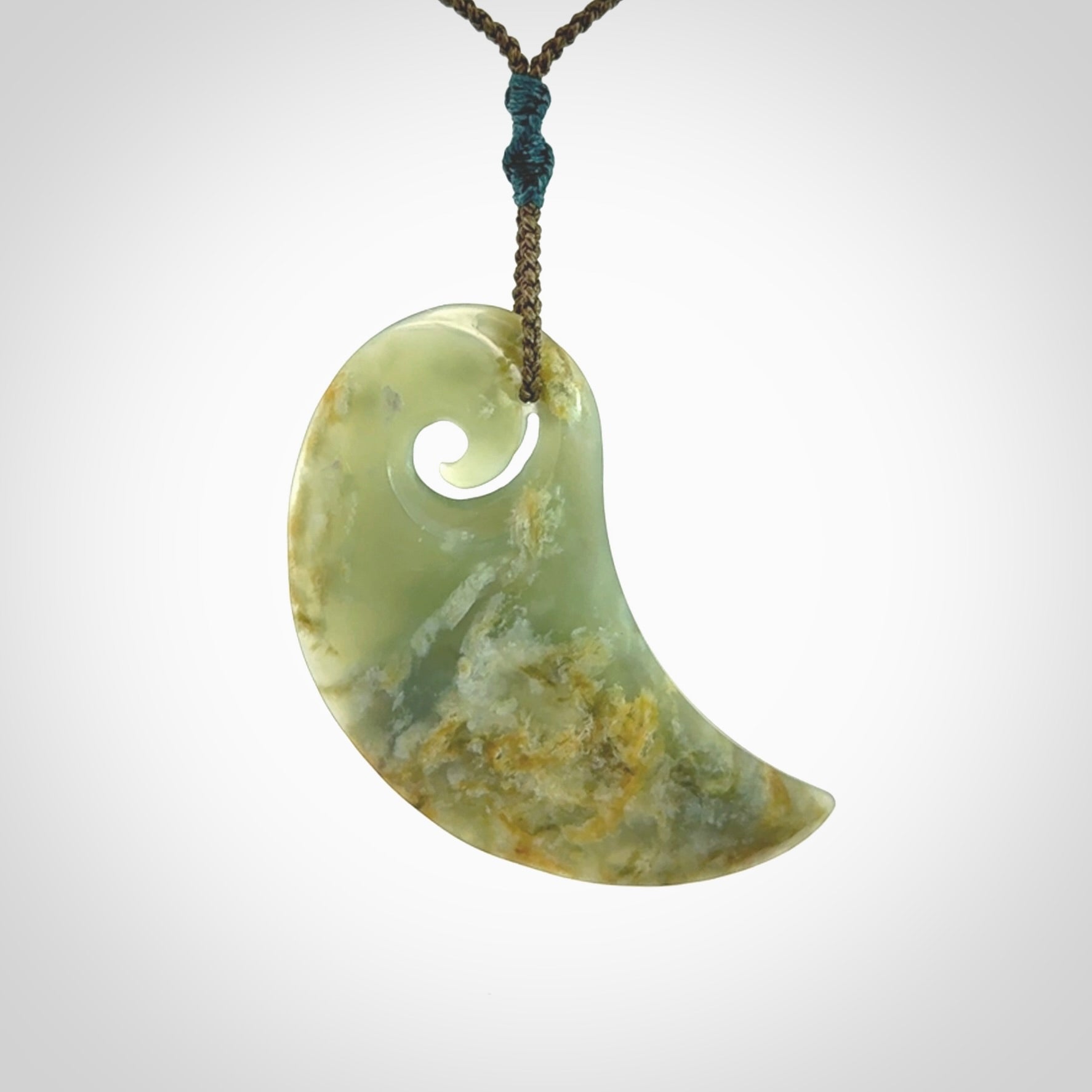 Beautifully Carved Koru drop pendant in delightful Jade