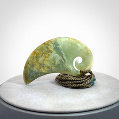 Beautifully Carved Koru drop pendant in delightful Jade