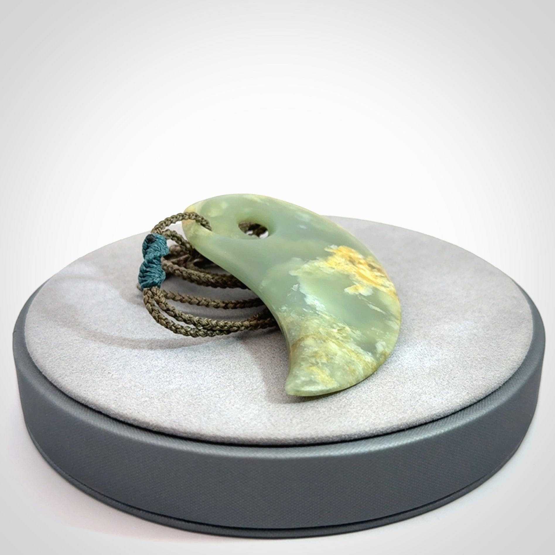 Beautifully Carved Koru drop pendant in delightful Jade