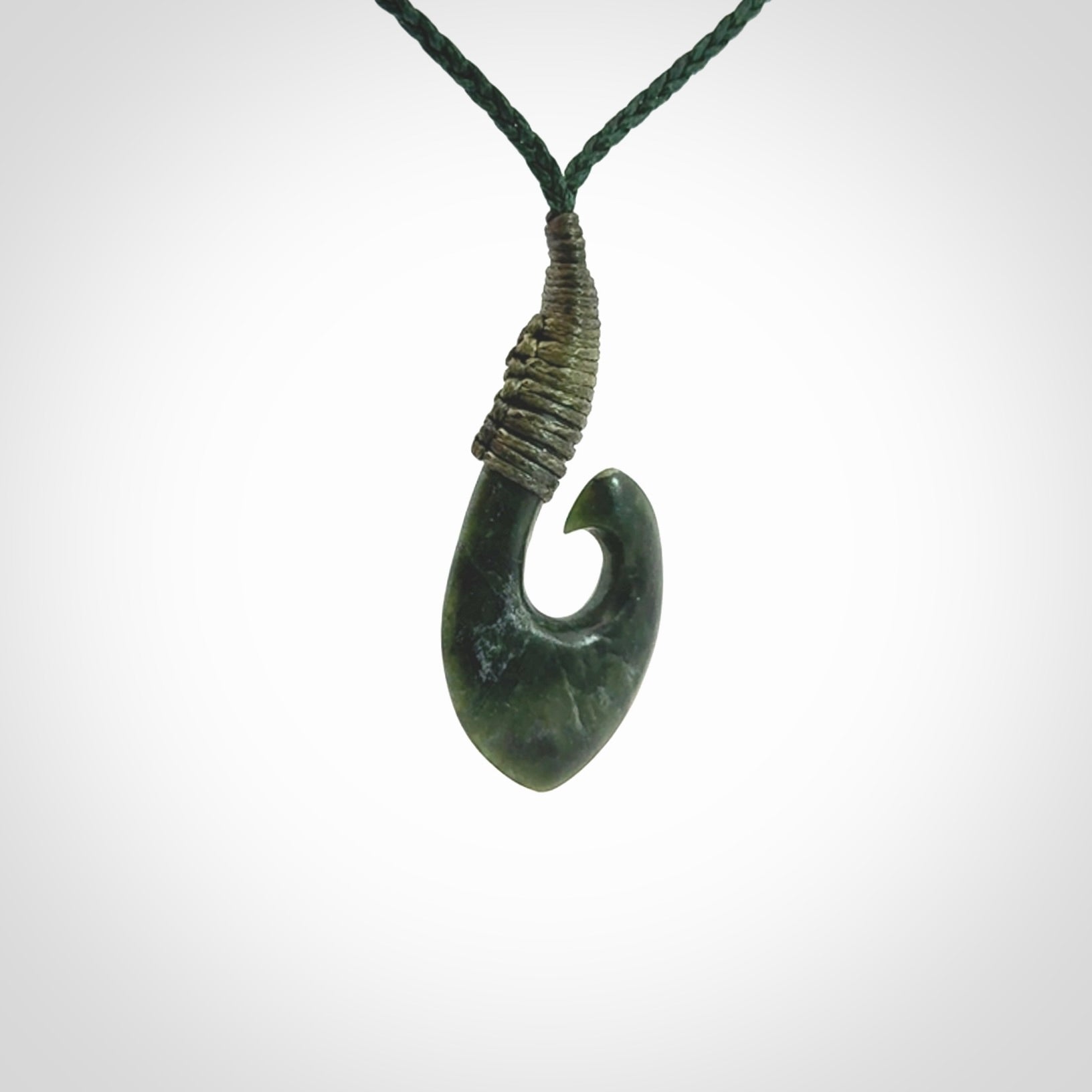 Hand carved New Zealand Jade hook pendant