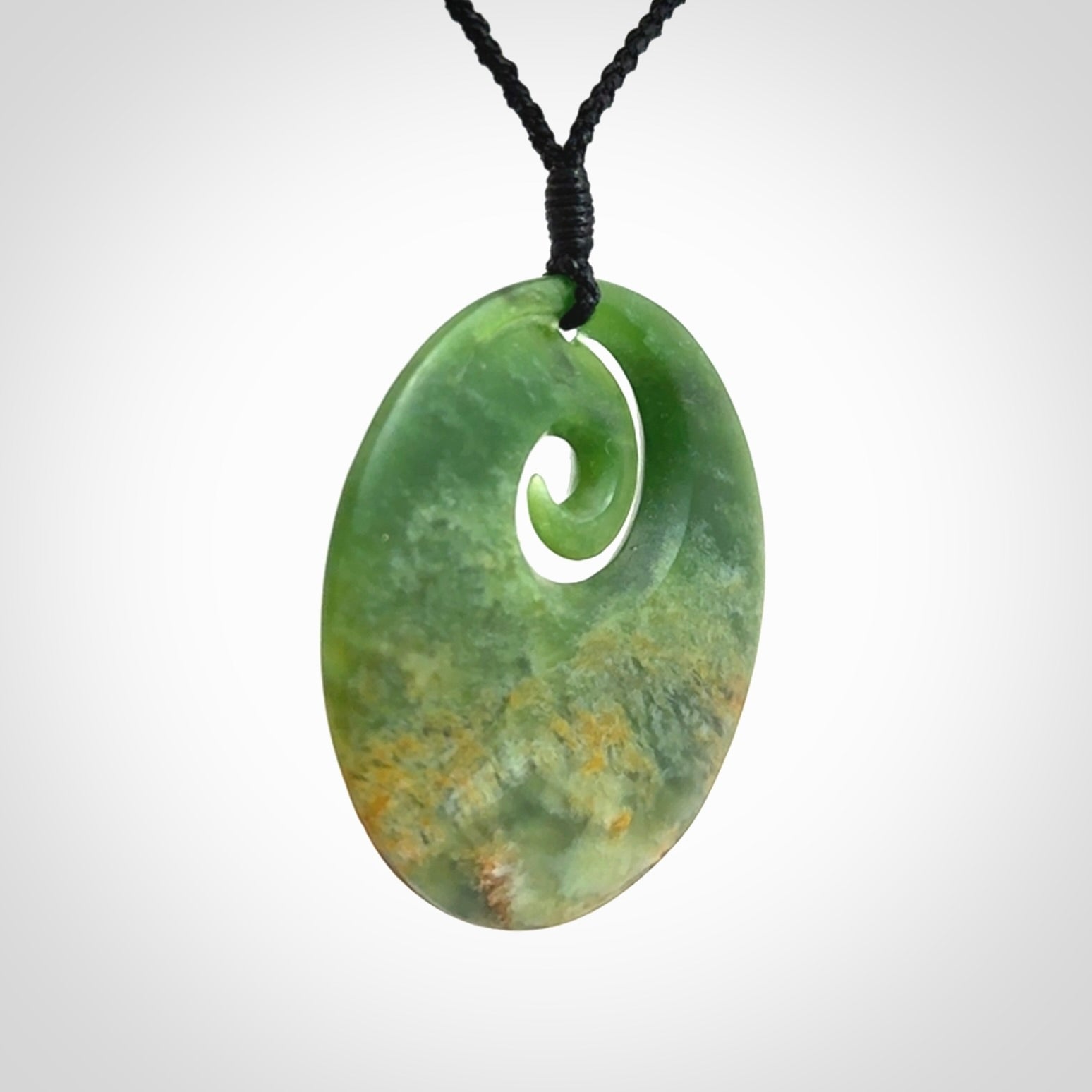 Hand carved New Zealand Flower Jade koru pendant