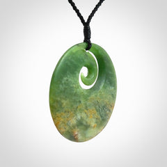 Hand carved New Zealand Flower Jade koru pendant