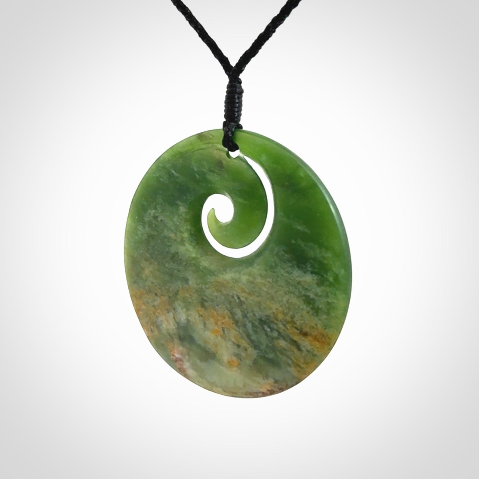 Hand carved New Zealand Flower Jade koru pendant