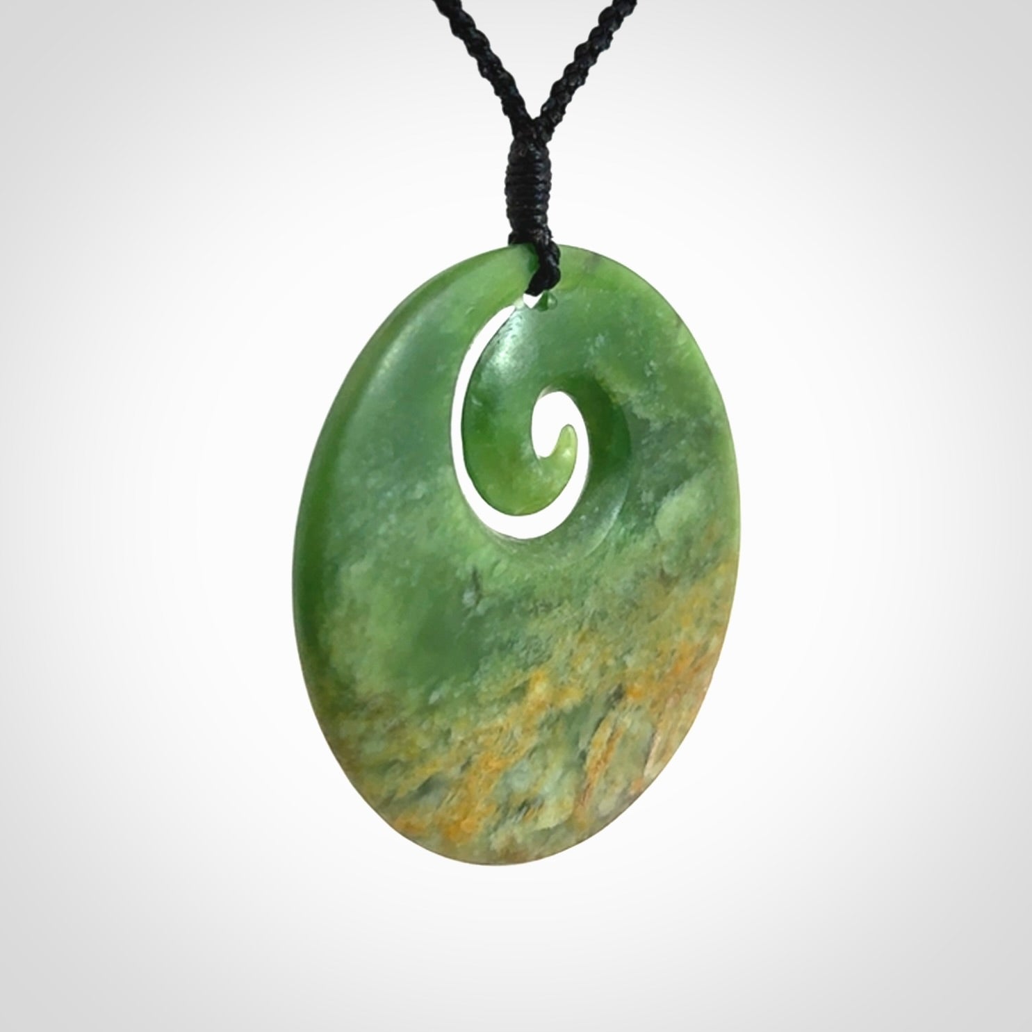 Hand carved New Zealand Flower Jade koru pendant