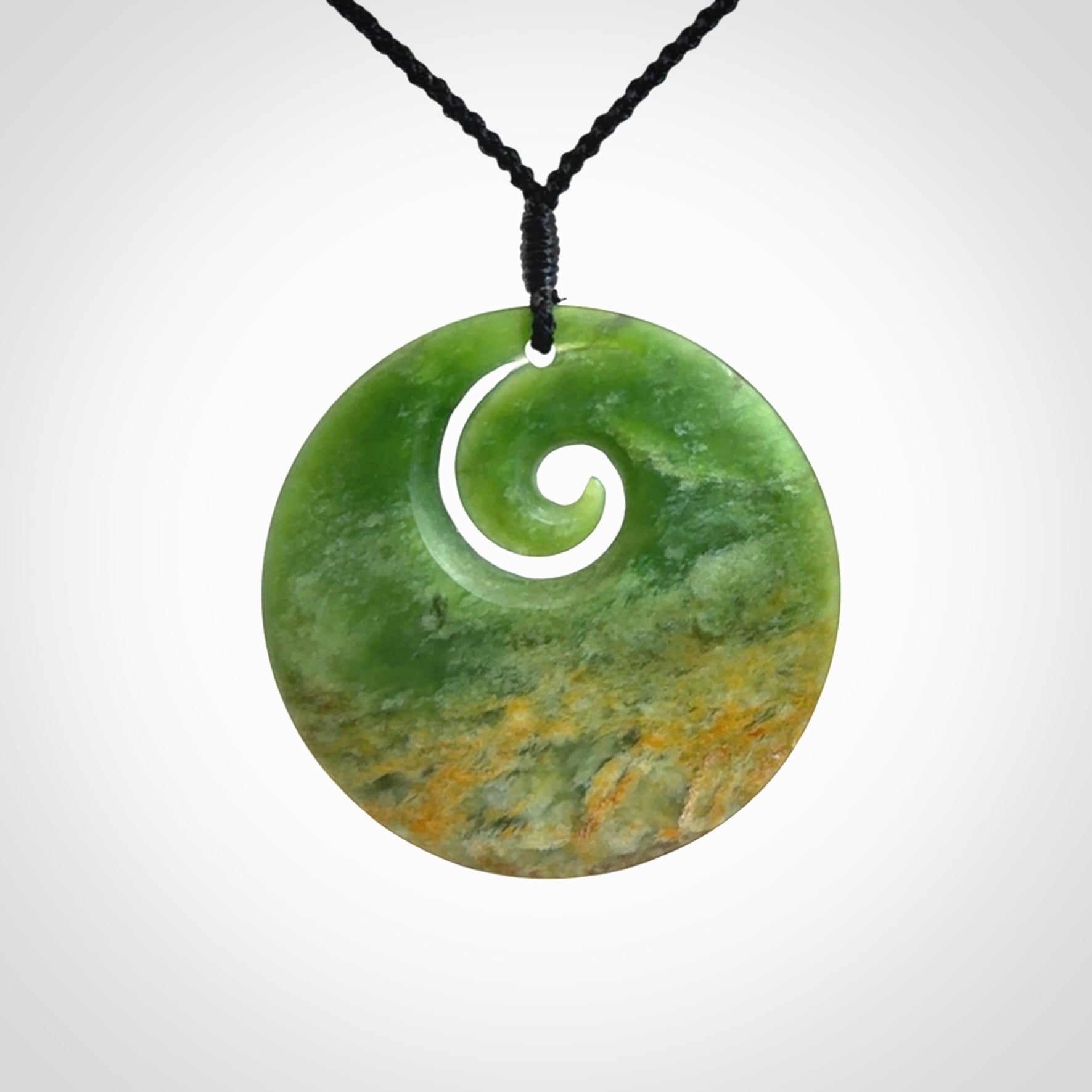 Hand carved New Zealand Flower Jade koru pendant