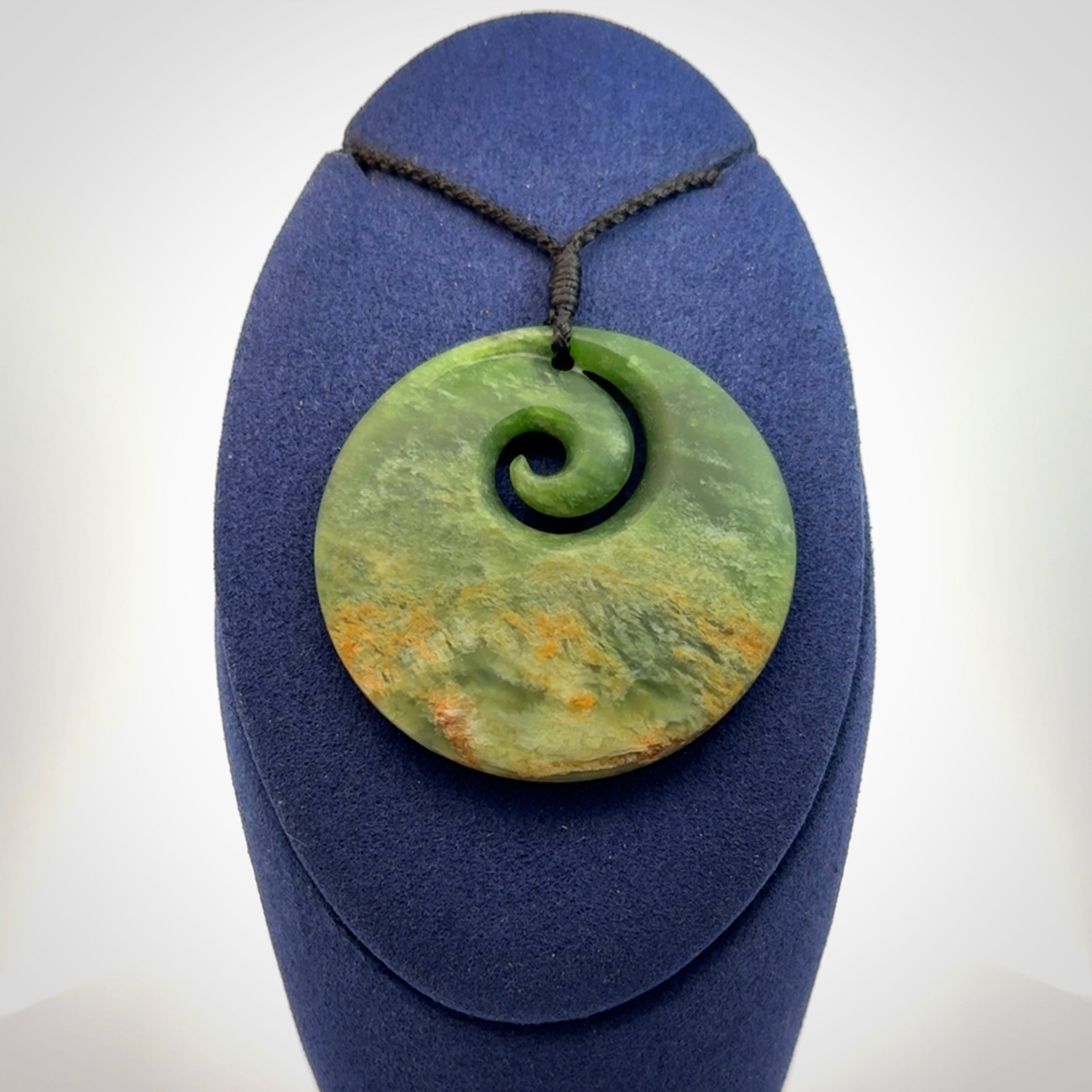 Hand carved New Zealand Flower Jade koru pendant