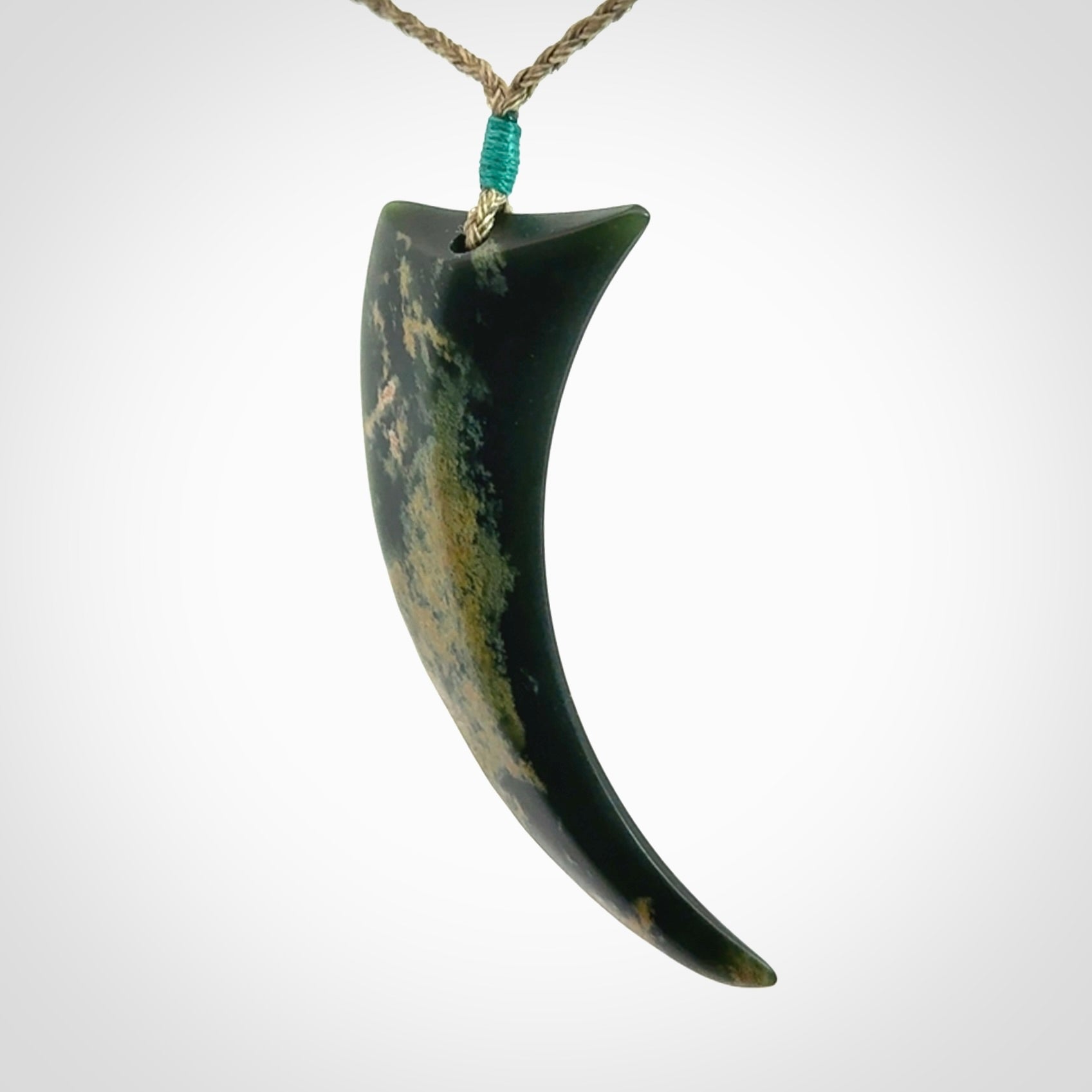 Hand Carved Niho Pendant in New Zealand Marsden Jade