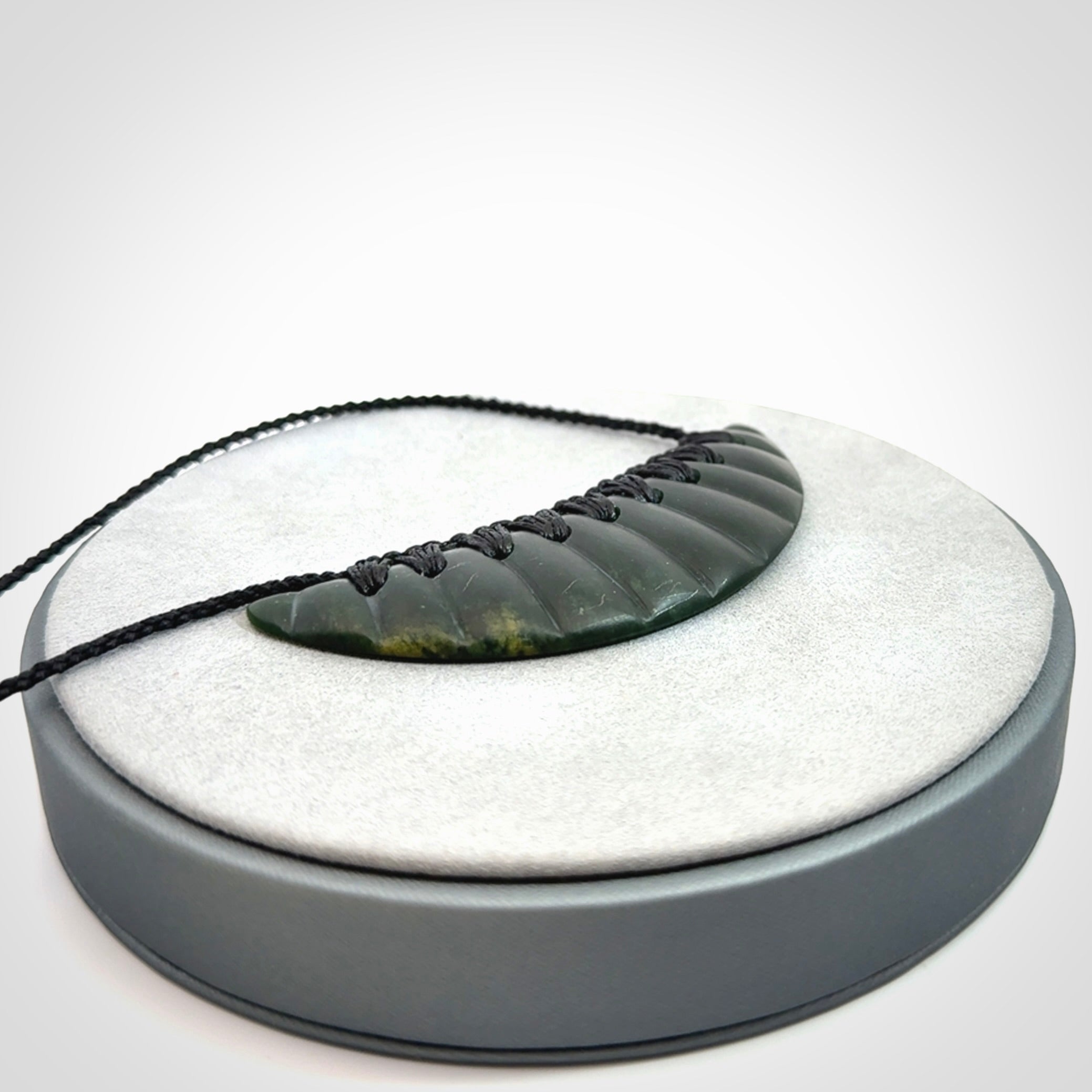 Hand carved New Zealand Jade shield pendant