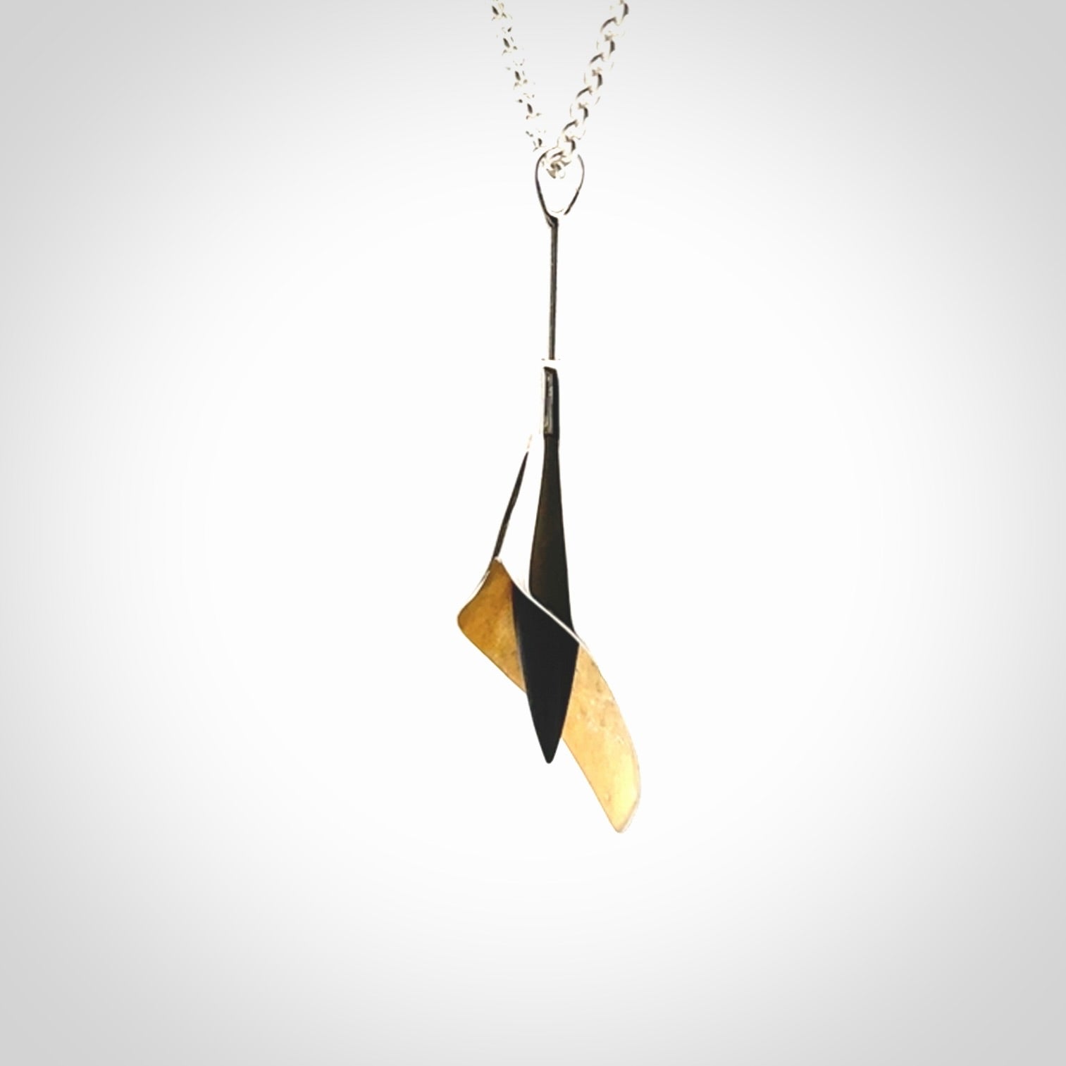 Sterling Silver drop pendant with Black Jade centre and Gold Plated interior. Provided with a sterling silver chain.