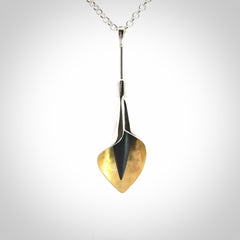 Sterling Silver drop pendant with Black Jade centre and Gold Plated interior. Provided with a sterling silver chain.