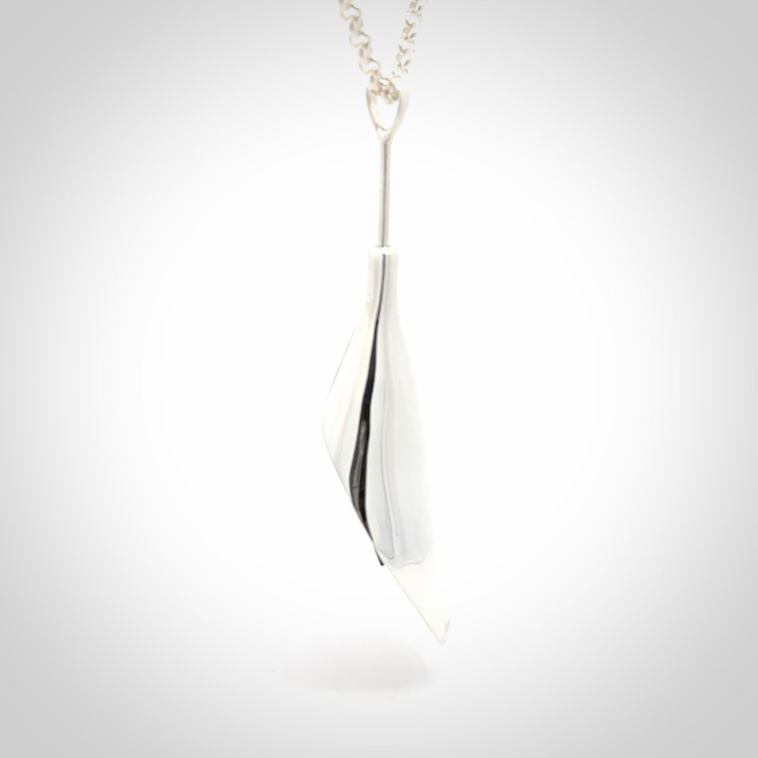 Sterling Silver drop pendant with Black Jade centre and Gold Plated interior. Provided with a sterling silver chain.