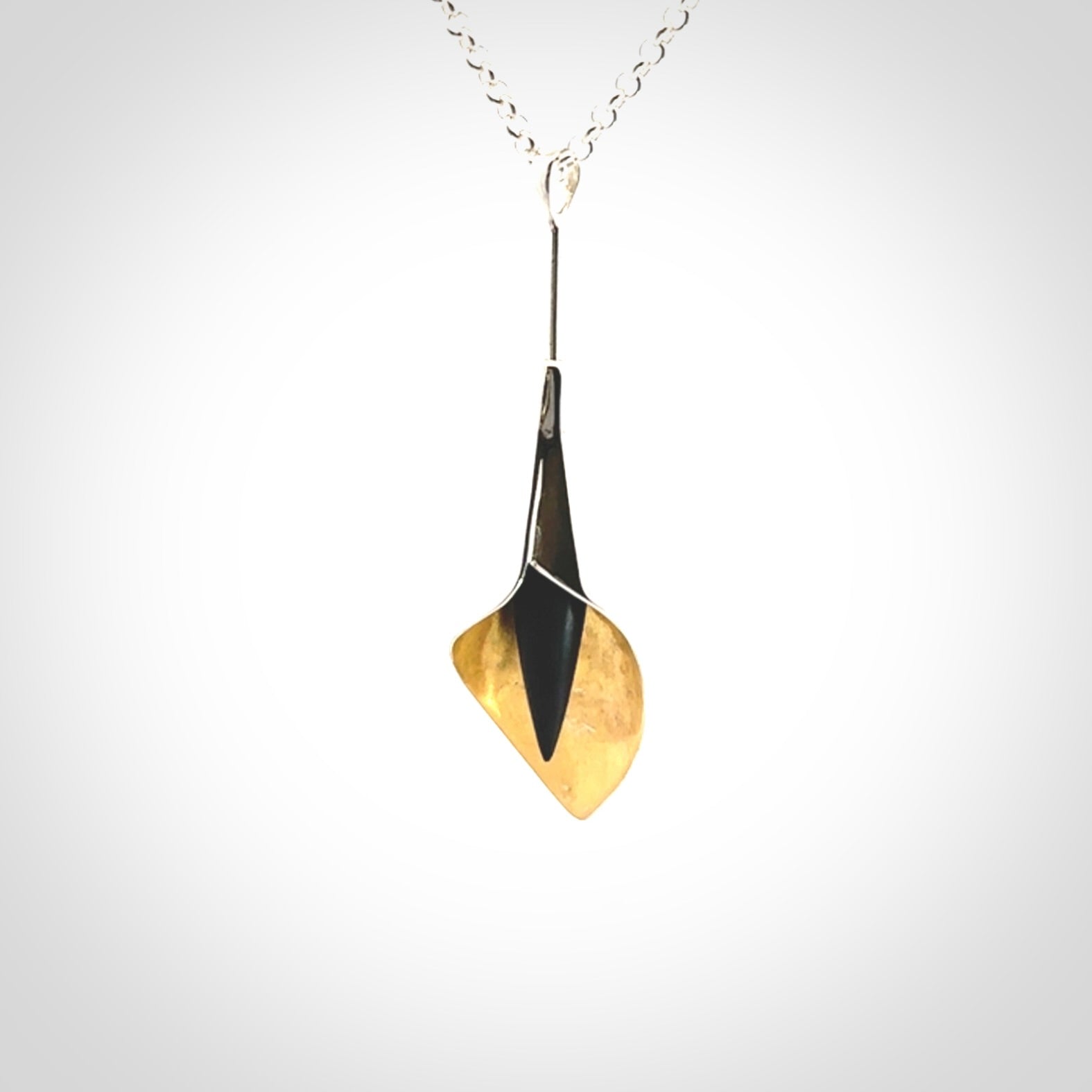 Sterling Silver drop pendant with Black Jade centre and Gold Plated interior. Provided with a sterling silver chain.