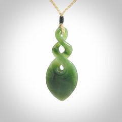 Hand carved New Zealand jade twist pendant. Carved in New Zealand by NZ Pacific. Unique double twist jewellery for sale online. Provided with an adjustable oat cord.