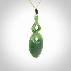 Hand carved New Zealand jade twist pendant. Carved in New Zealand by NZ Pacific. Unique double twist jewellery for sale online. Provided with an adjustable oat cord.
