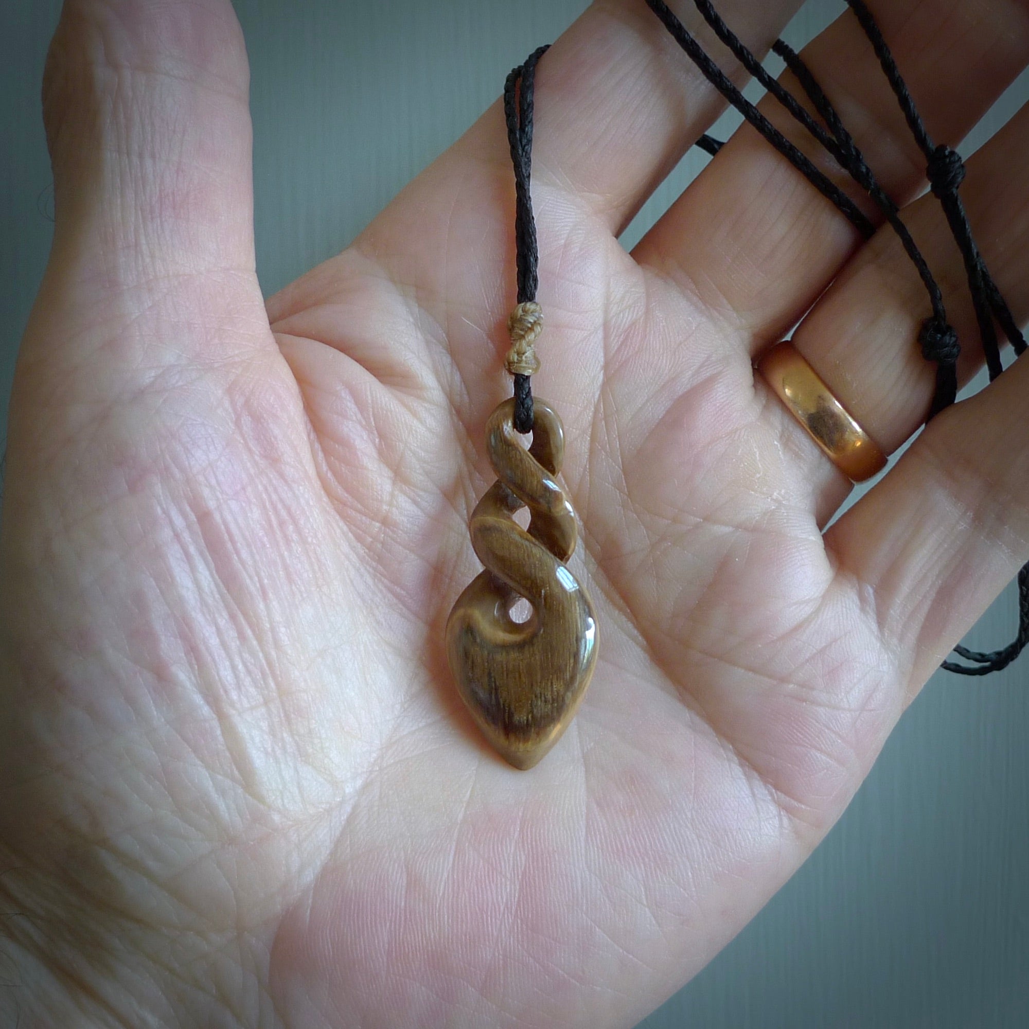 Hand carved woolly mammoth tusk twist pendant. Hand made jewellery made by NZ Pacific and for sale online. South Pacific jewellery.