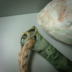 Hand carved wahaika Pounamu. Art to display. One only hand made wahaika display piece with base. New Zealand wahaika carved in Pounamu, Jade by Kerry Thompson. Free delivery worldwide.