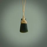 Hand carved jade toki by Ric Moor. Made in New Zealand by NZ Pacific. Hand carved Toki pendants crafted from beautiful New Zealand Pounamu, Jade. We deliver these with Express Courier, on adjustable cords.