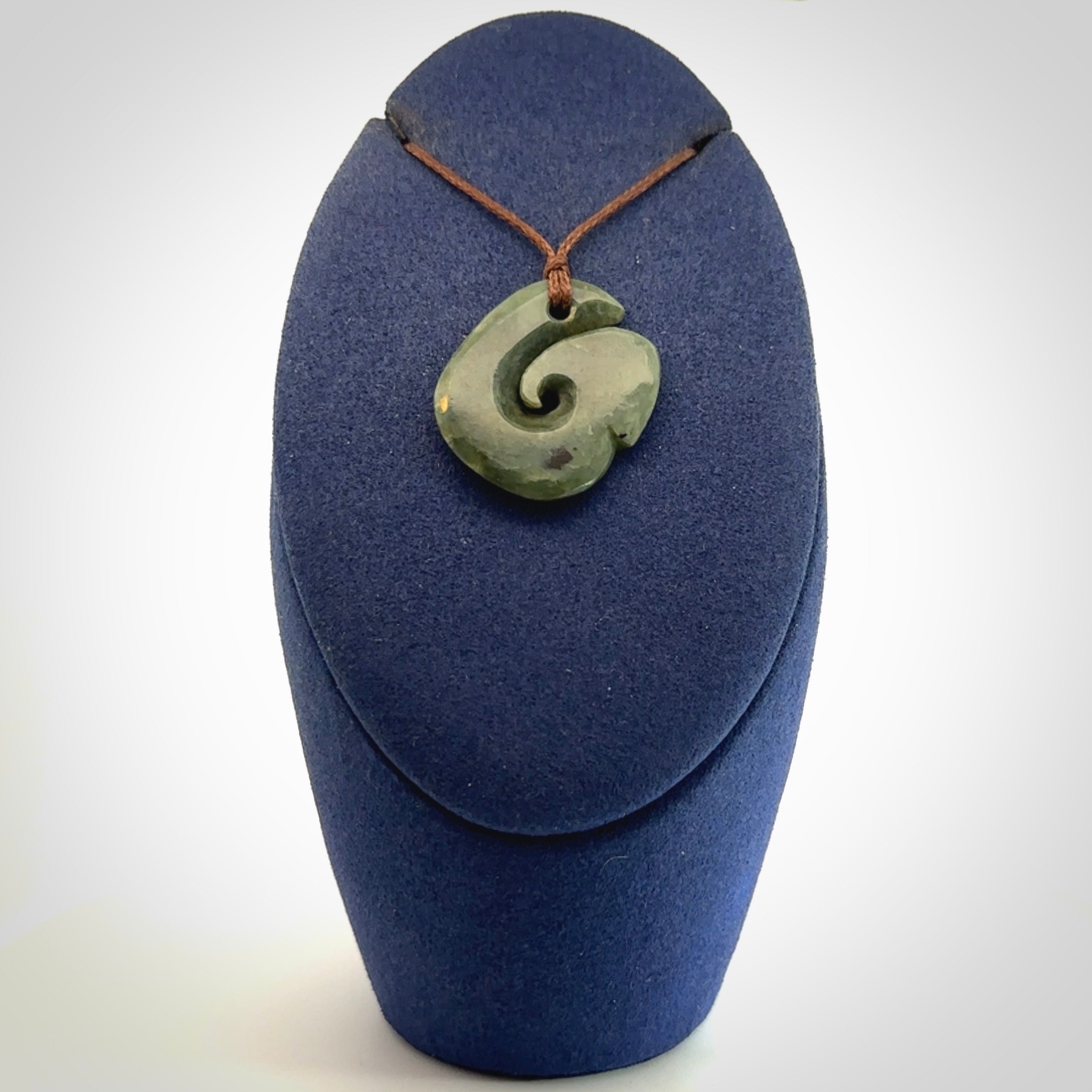 A lovely jade koru pendant