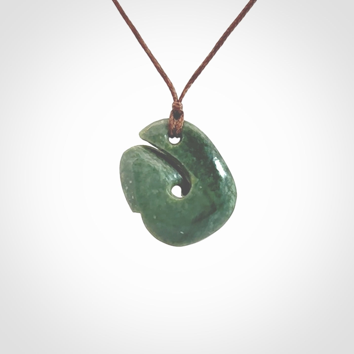 A lovely jade koru pendant