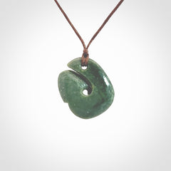 A lovely jade koru pendant