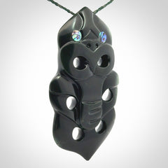 This is a large hand carved New Zealand Jade tiki pendant. It is made from New Zealand Jade and Paua shell.