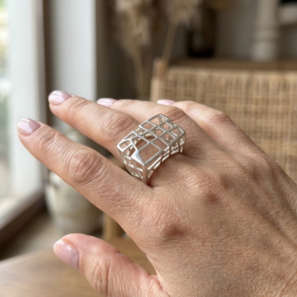 Hand with cage ring on display