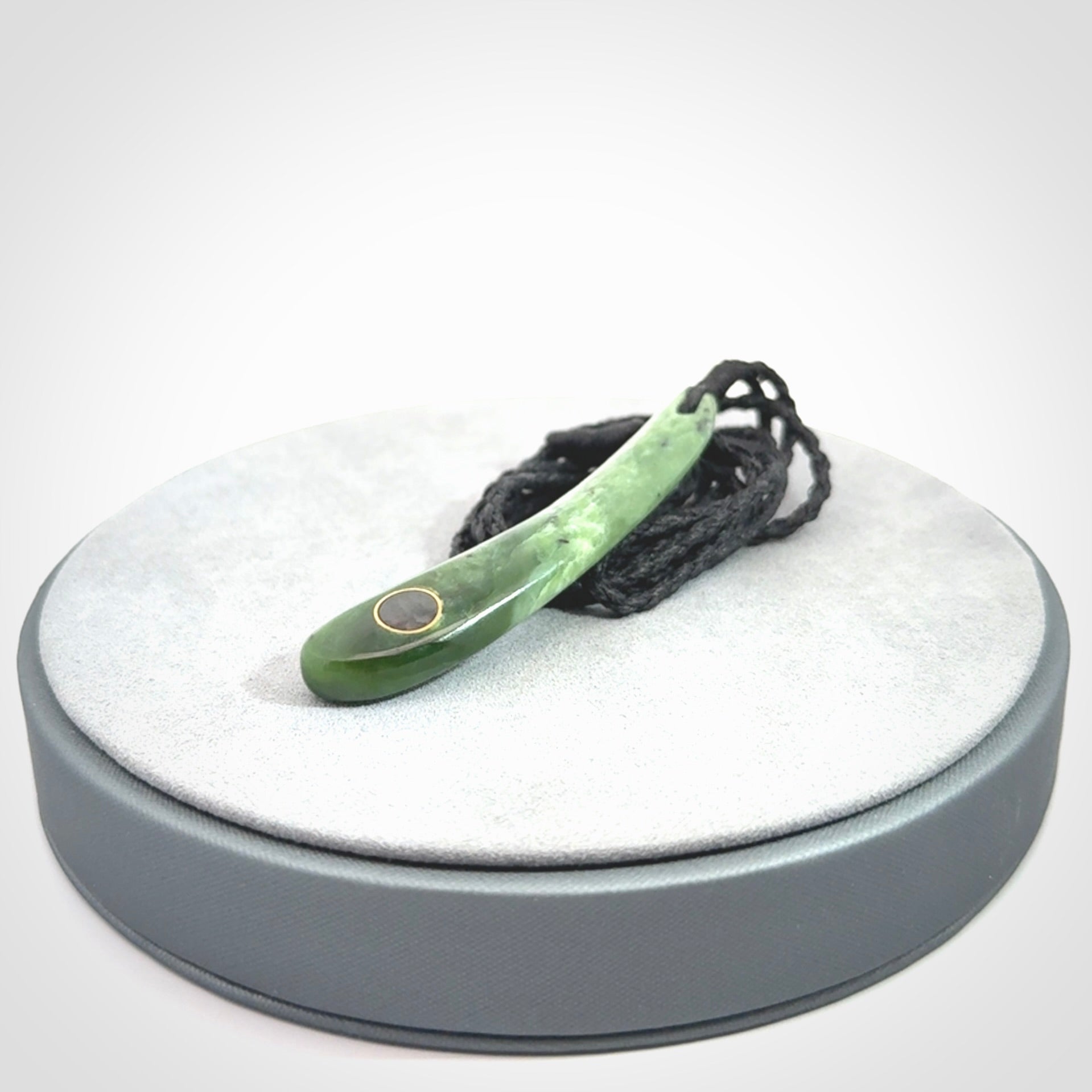 This is a wonderful New Zealand Jade drop pendant with black mother of pearl and brass inlay.