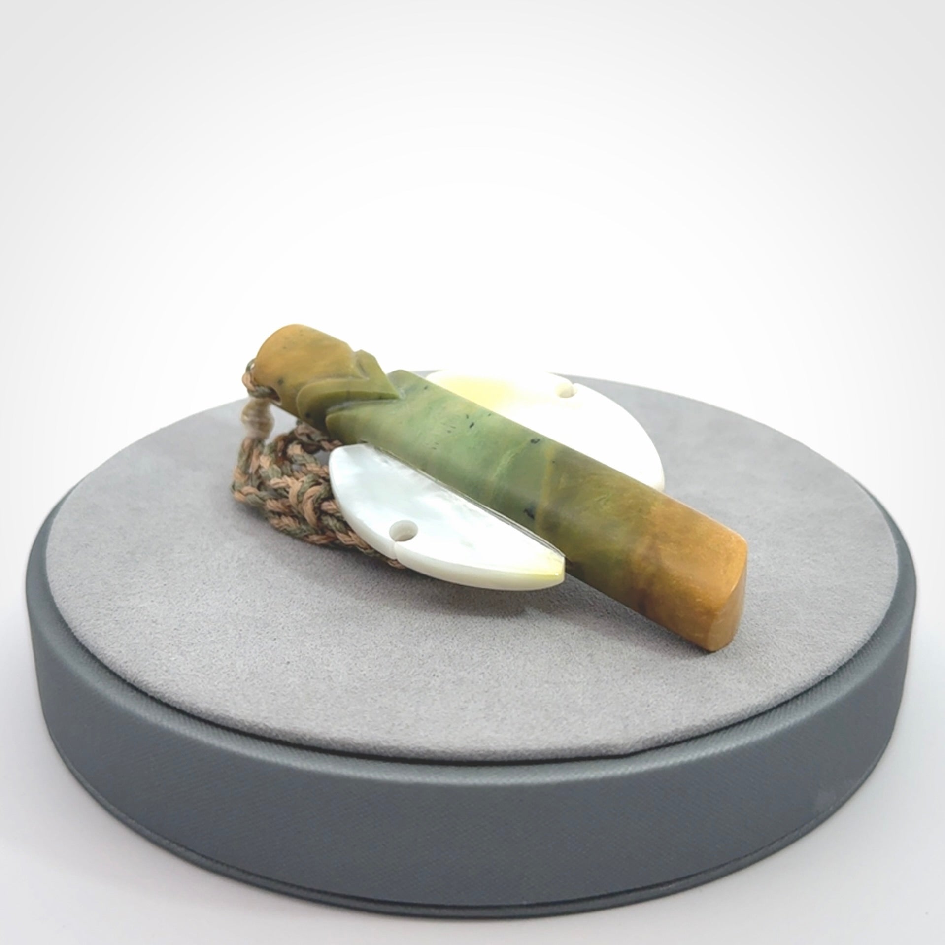 This is a wonderful New Zealand Jade and Mother of Pearl drop pendant.