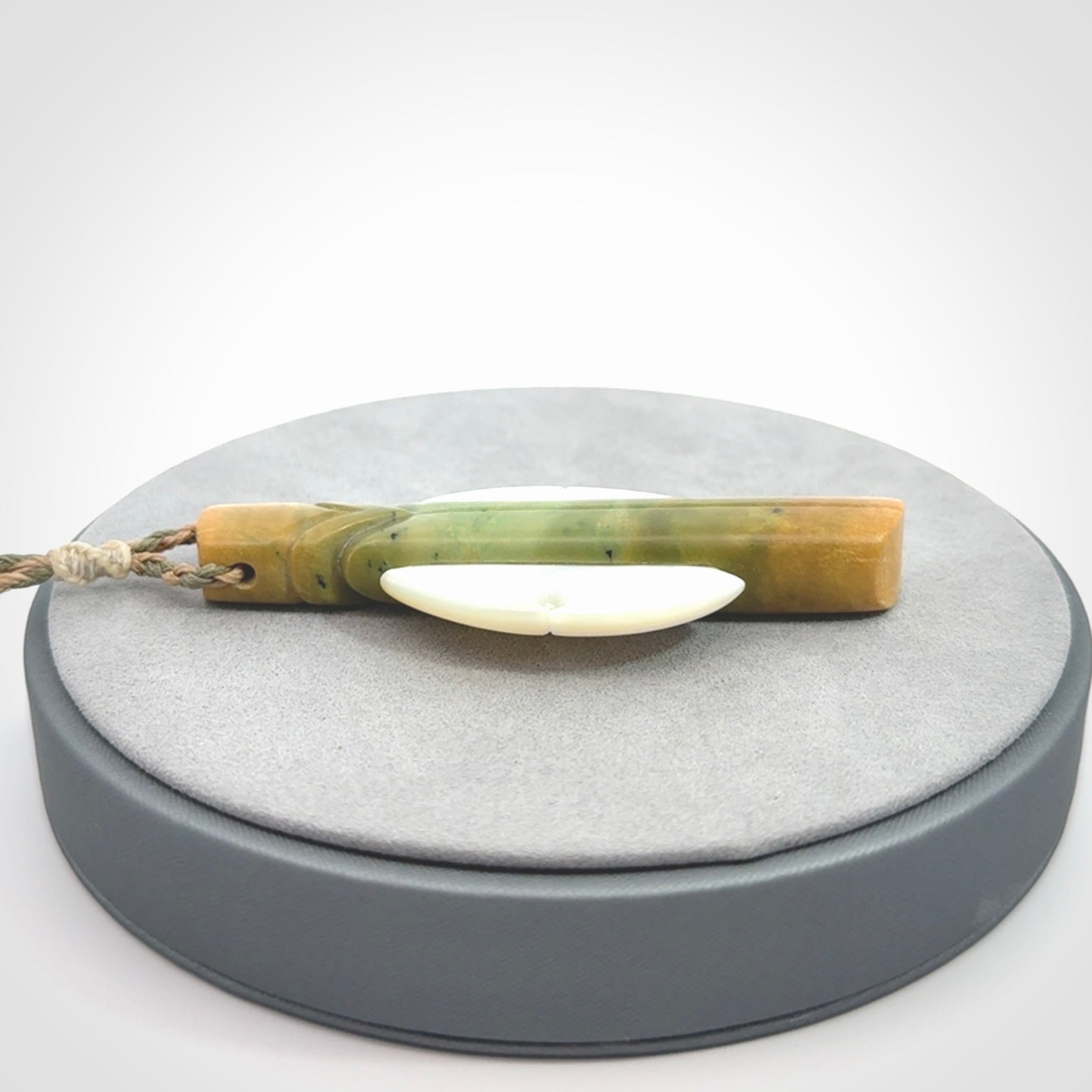 This is a wonderful New Zealand Jade and Mother of Pearl drop pendant.