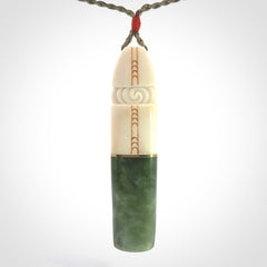 This is a wonderful New Zealand Jade and Bone drop pendant with brass inlay.