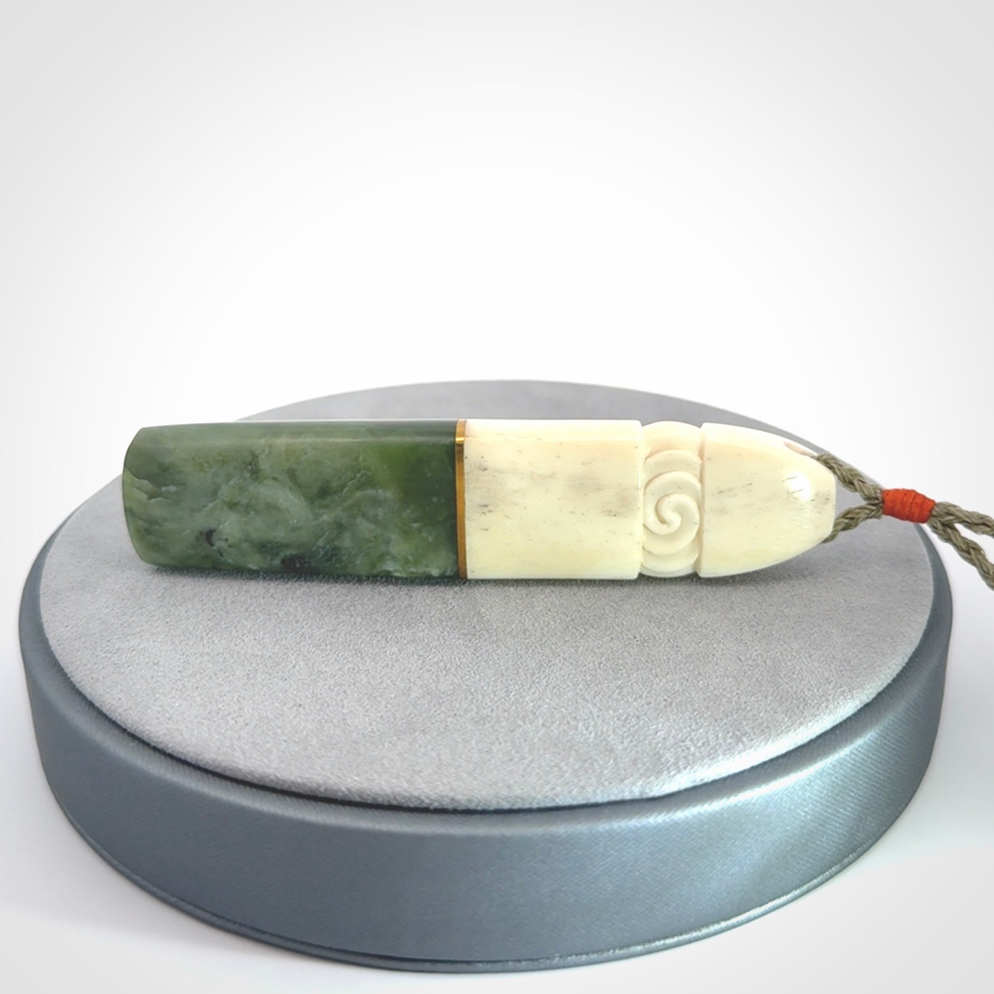 This is a wonderful New Zealand Jade and Bone drop pendant with brass inlay.