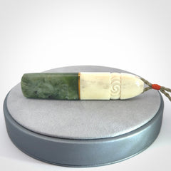 This is a wonderful New Zealand Jade and Bone drop pendant with brass inlay.