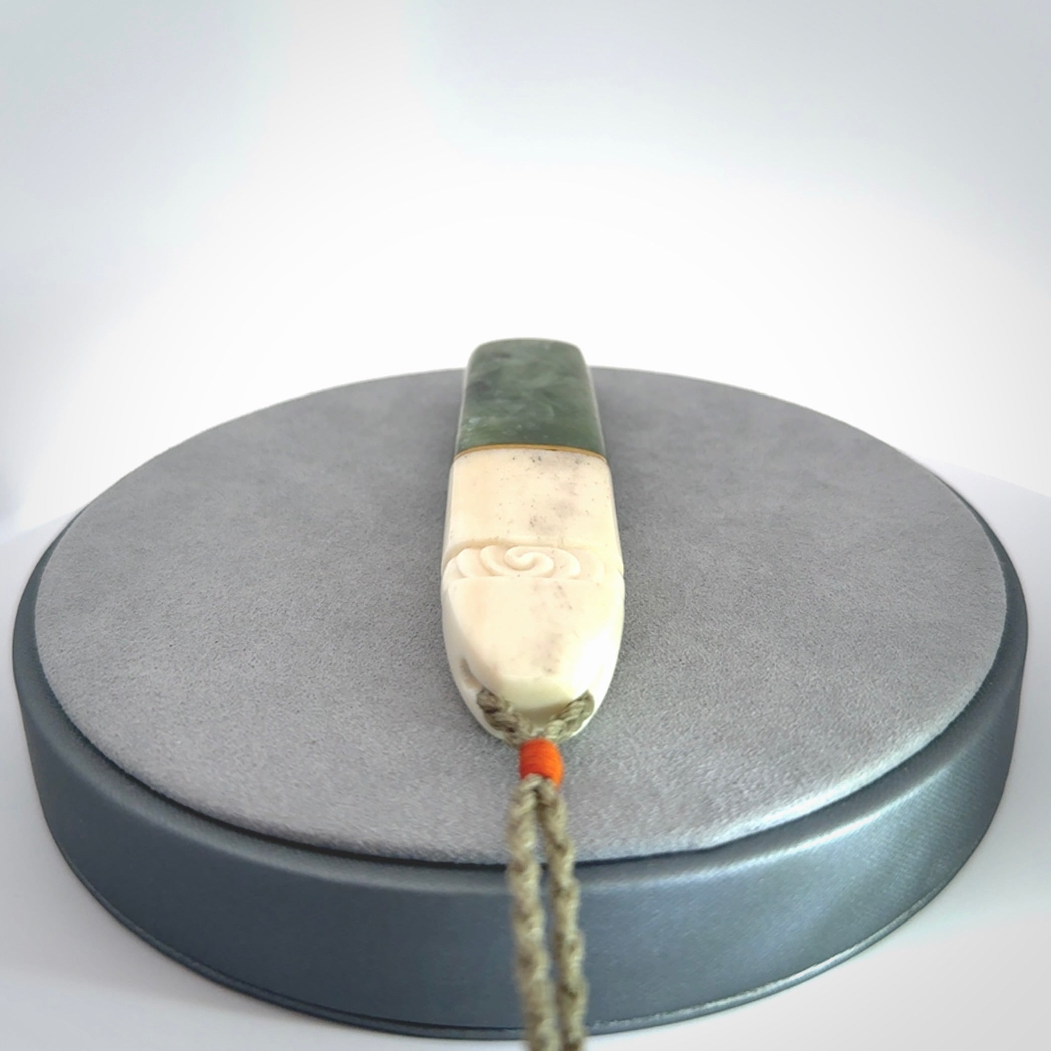 This is a wonderful New Zealand Jade and Bone drop pendant with brass inlay.