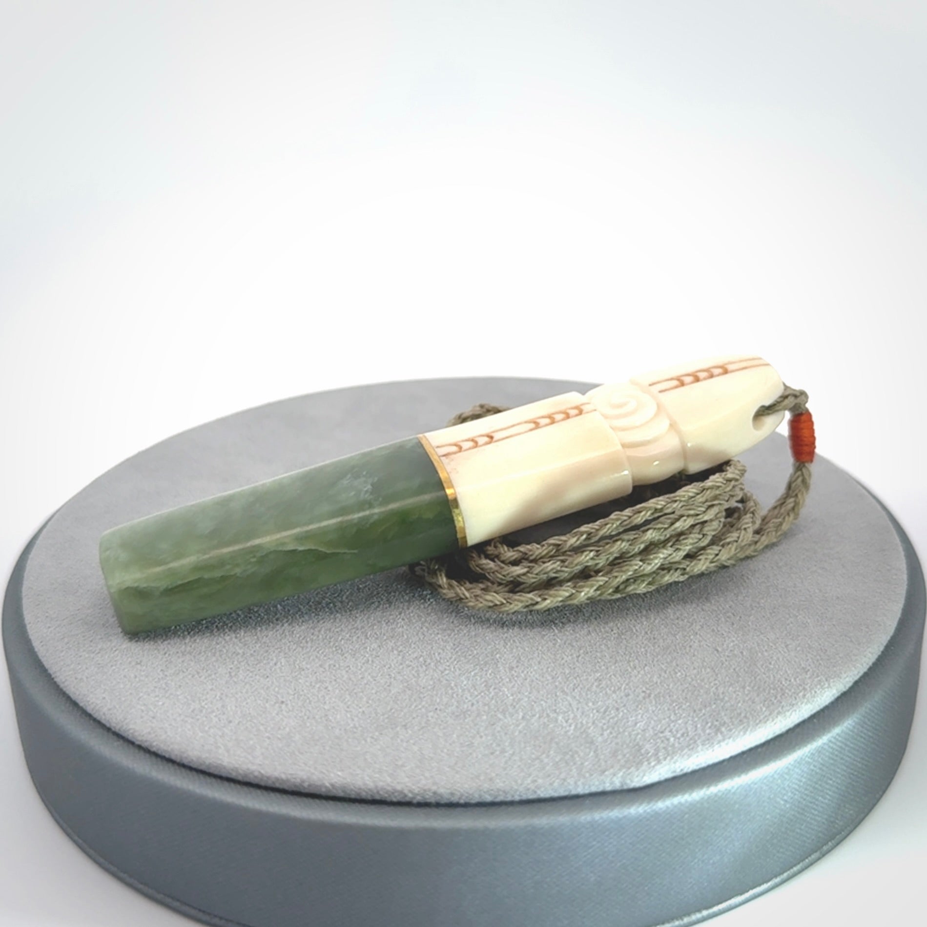 This is a wonderful New Zealand Jade and Bone drop pendant with brass inlay.