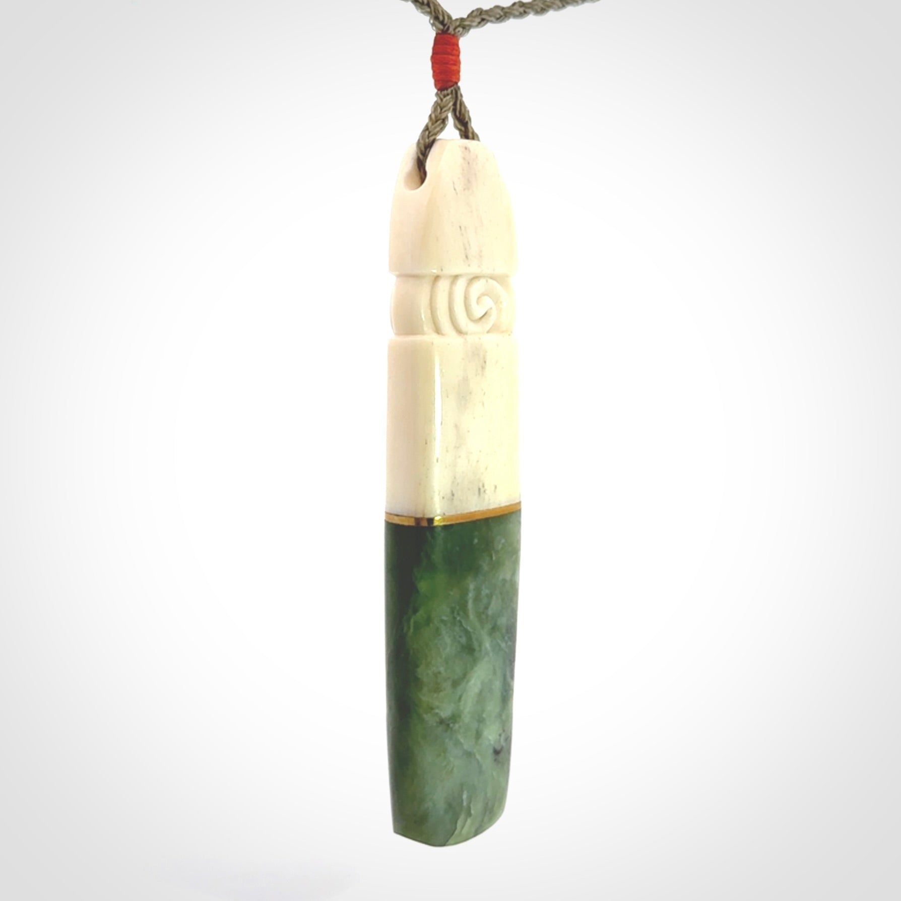 This is a wonderful New Zealand Jade and Bone drop pendant with brass inlay.