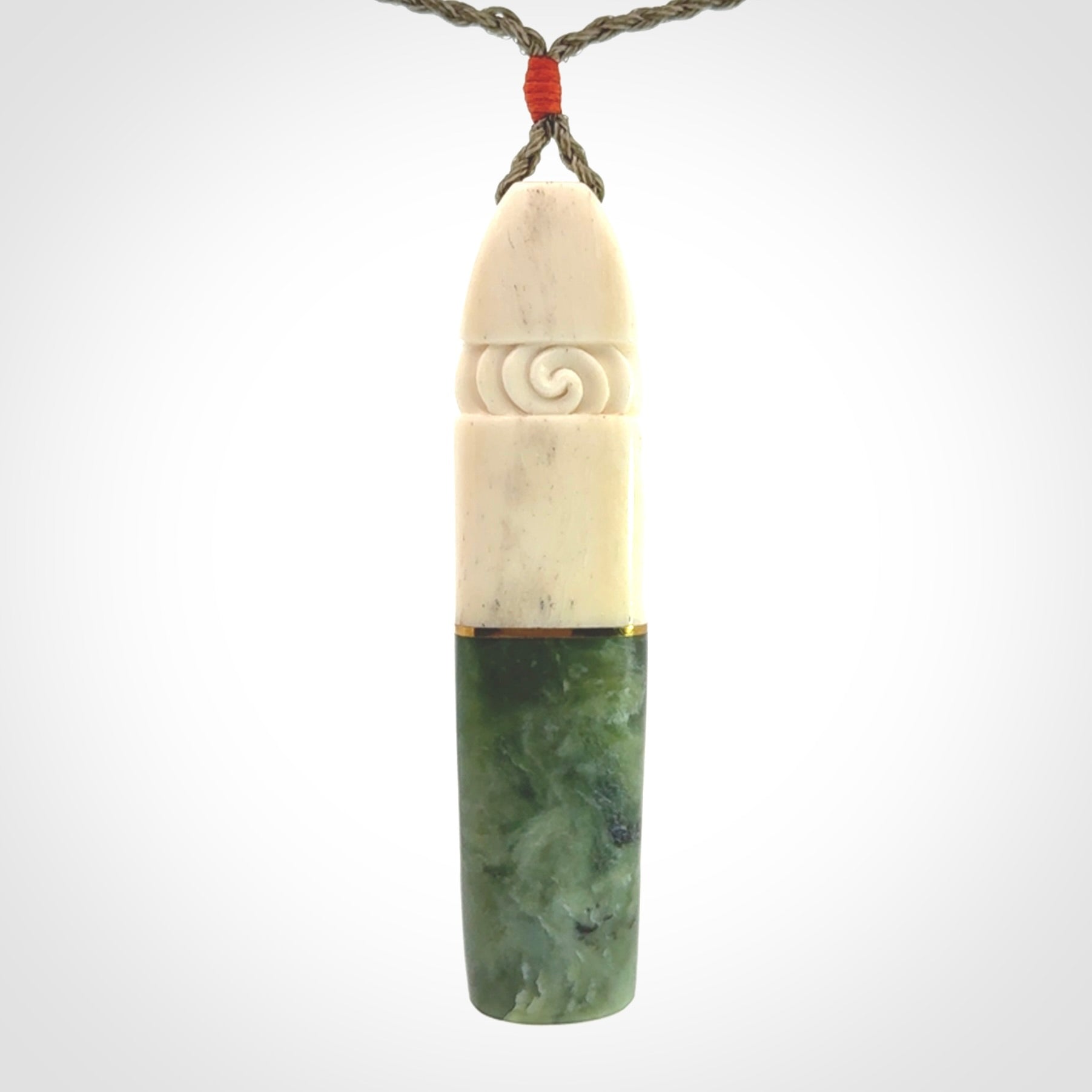 This is a wonderful New Zealand Jade and Bone drop pendant with brass inlay.