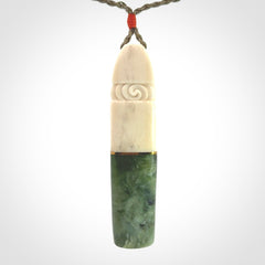 This is a wonderful New Zealand Jade and Bone drop pendant with brass inlay.