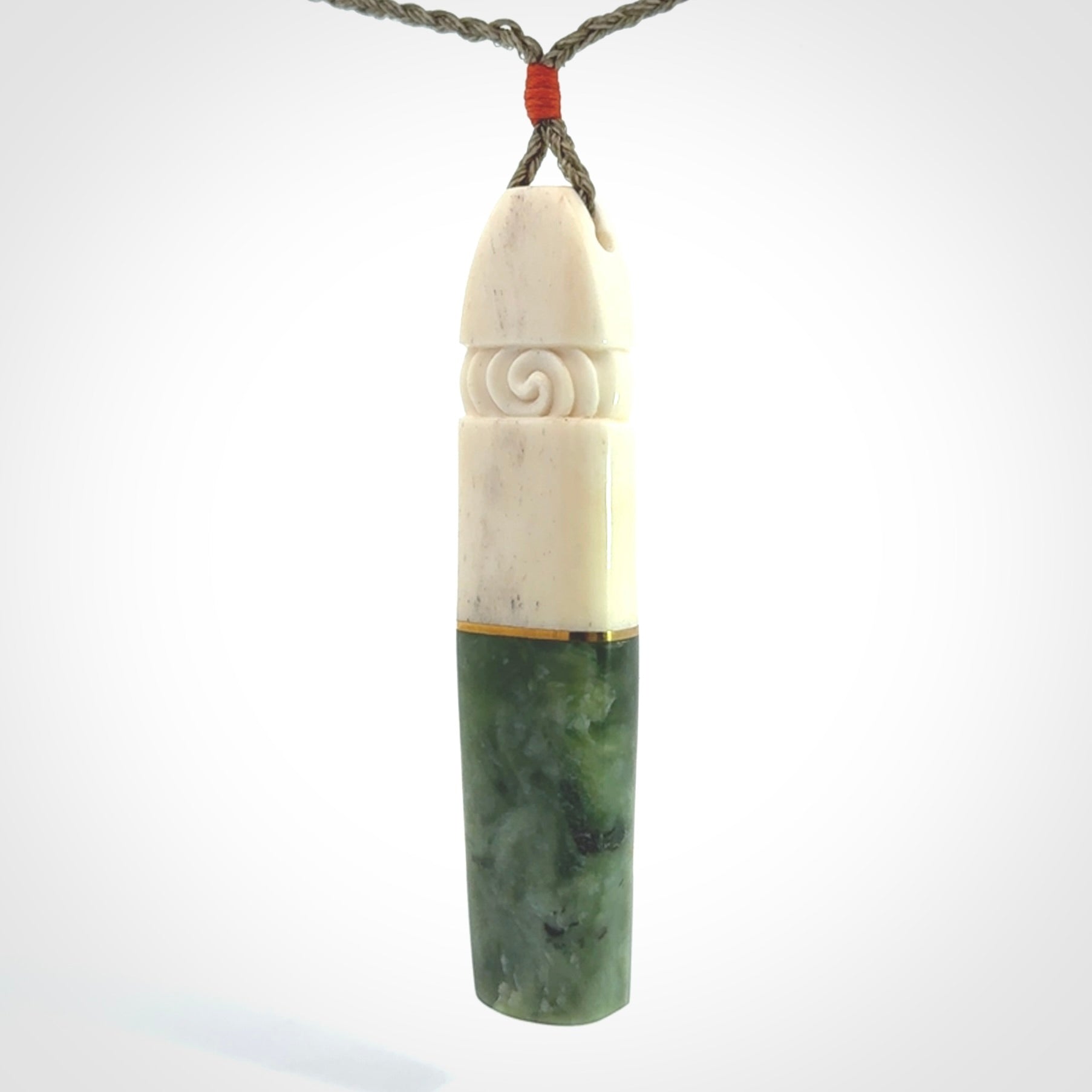 This is a wonderful New Zealand Jade and Bone drop pendant with brass inlay.