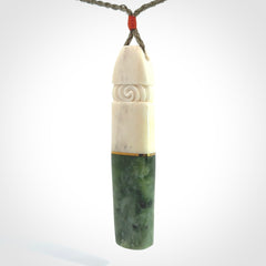 This is a wonderful New Zealand Jade and Bone drop pendant with brass inlay.