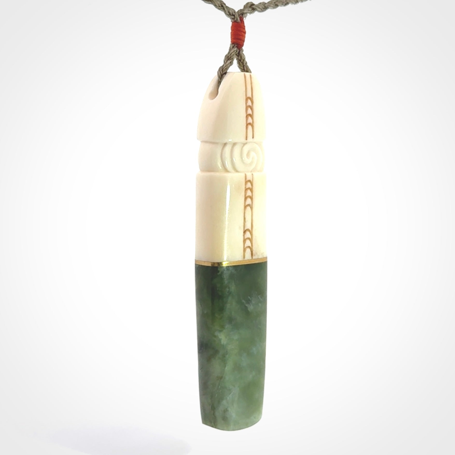 This is a wonderful New Zealand Jade and Bone drop pendant with brass inlay.
