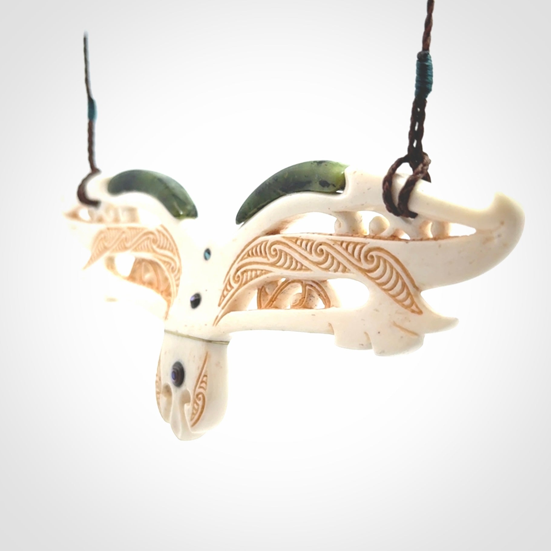 This is a wonderful New Zealand Jade and Bone necklace that can also be displayed as a sculpture with wooden stand.