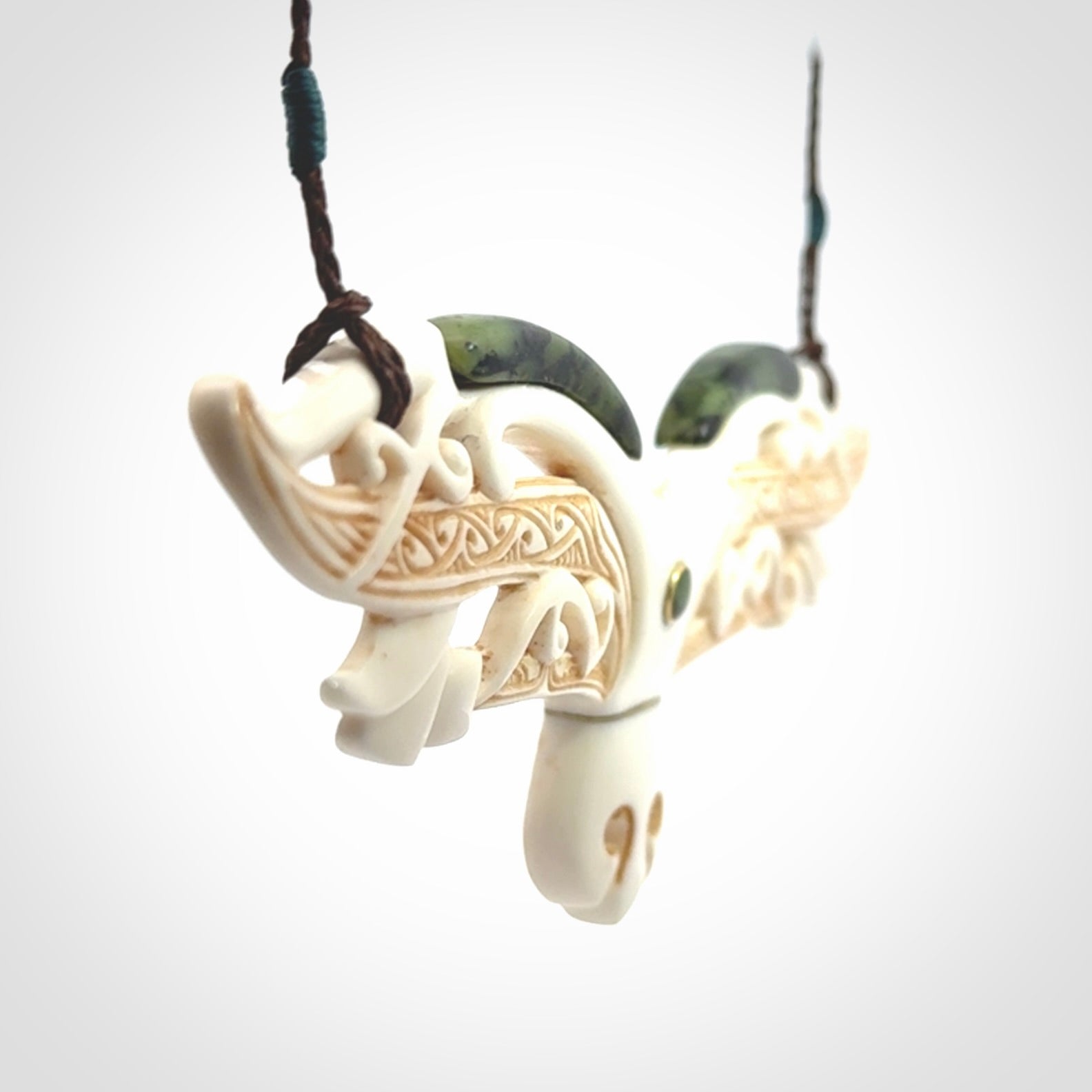This is a wonderful New Zealand Jade and Bone necklace that can also be displayed as a sculpture with wooden stand.