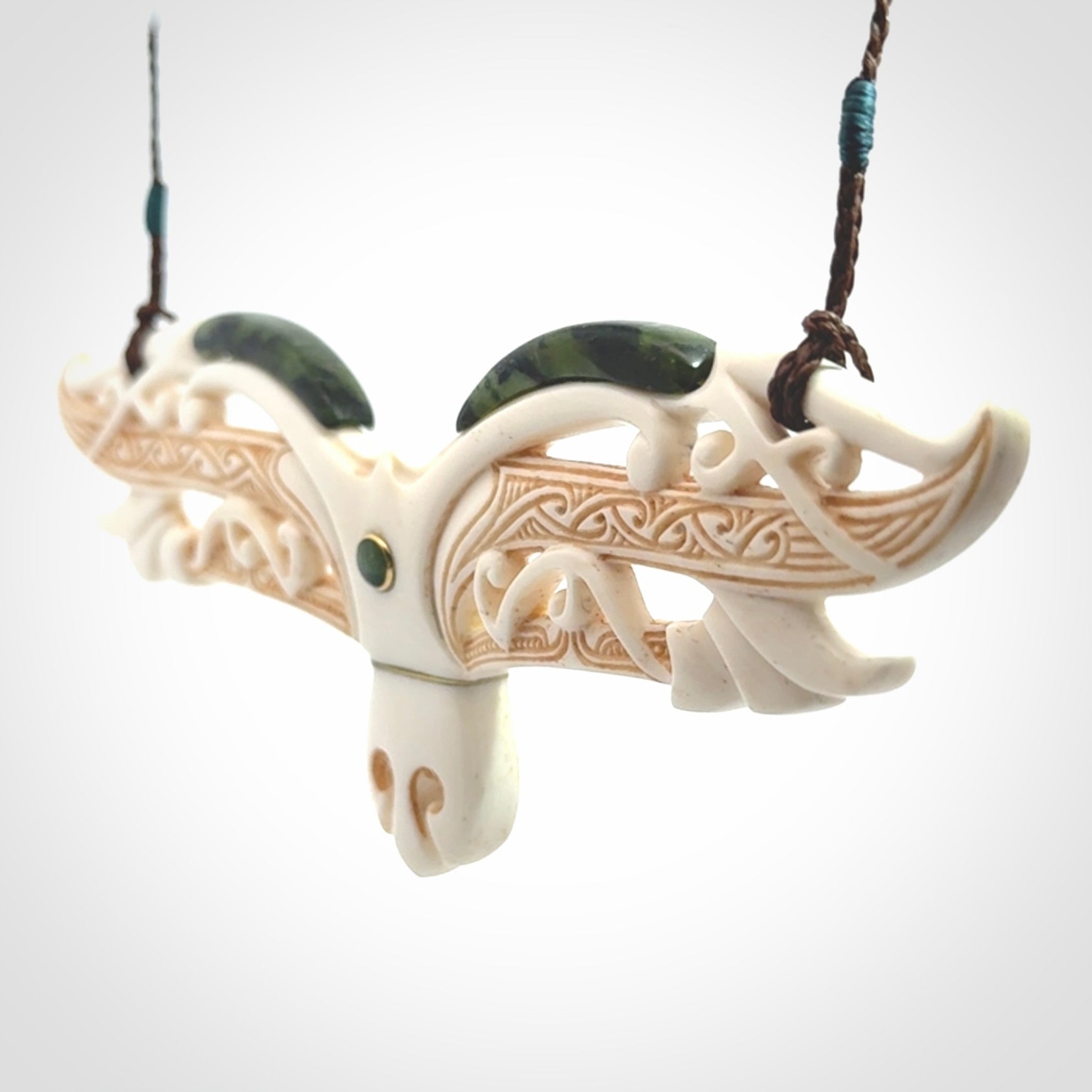 This is a wonderful New Zealand Jade and Bone necklace that can also be displayed as a sculpture with wooden stand.