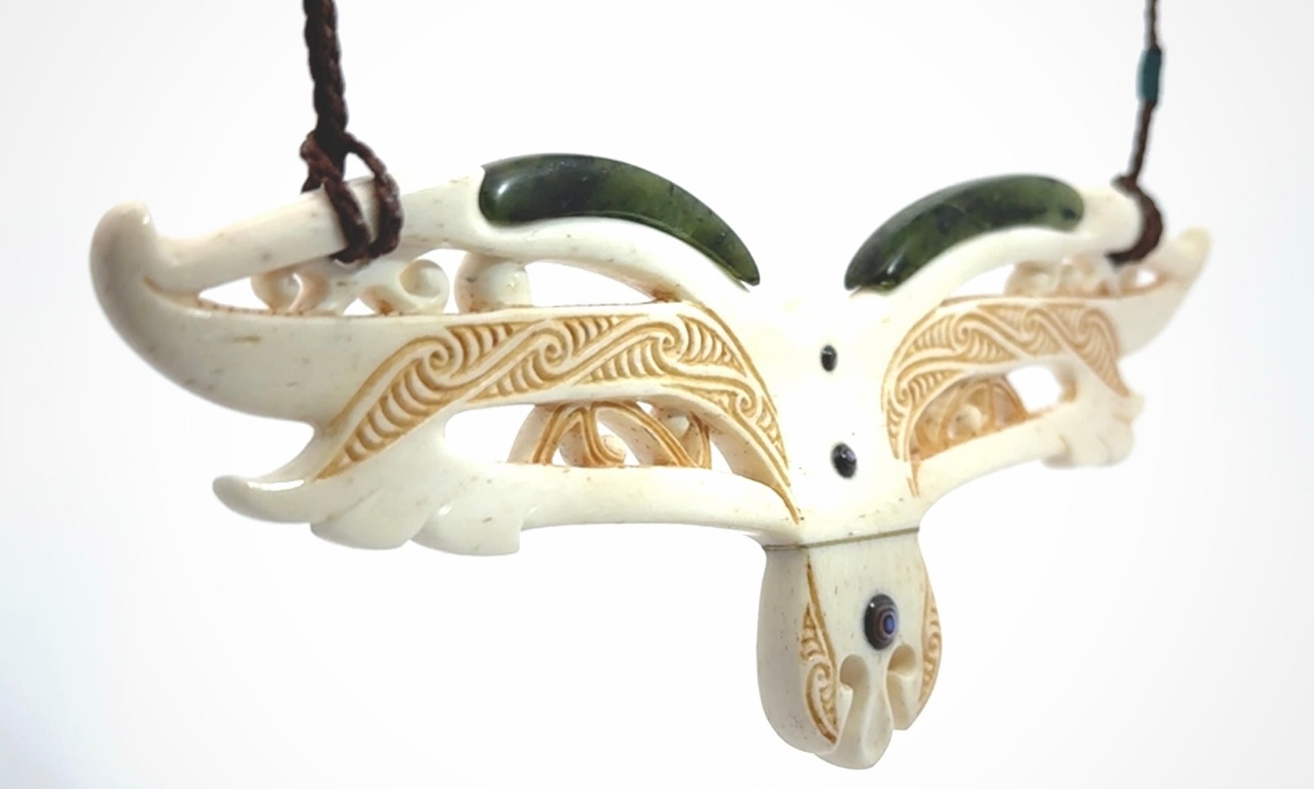 This is a wonderful New Zealand Jade and Bone necklace that can also be displayed as a sculpture with wooden stand.