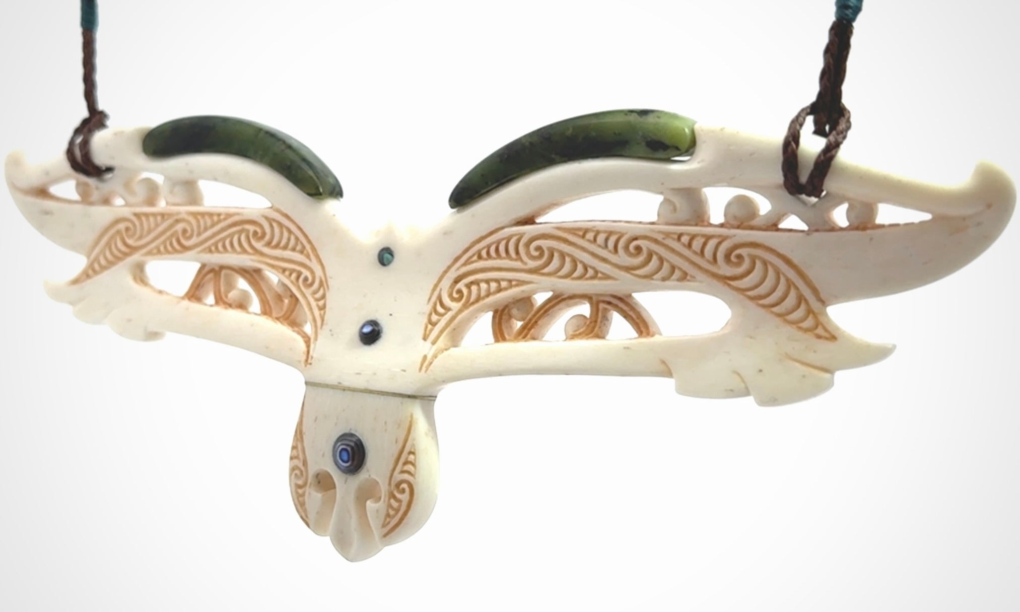 This is a wonderful New Zealand Jade and Bone necklace that can also be displayed as a sculpture with wooden stand.