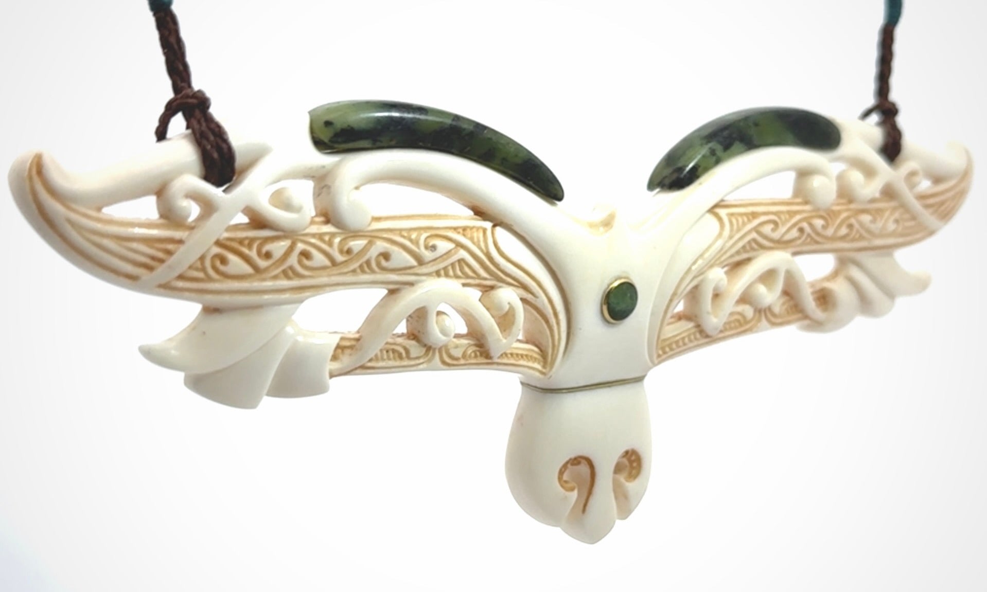 This is a wonderful New Zealand Jade and Bone necklace that can also be displayed as a sculpture with wooden stand.