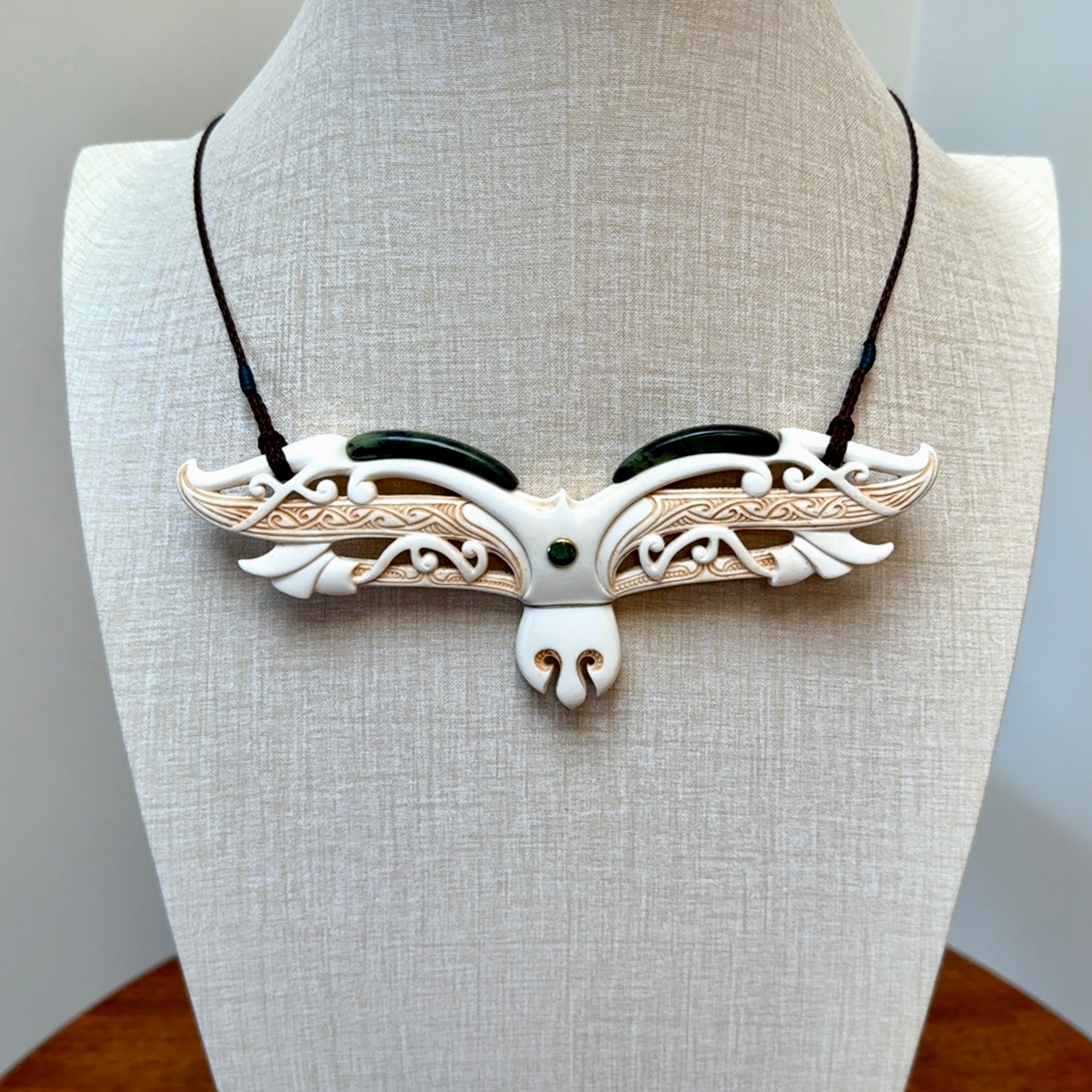 This is a wonderful New Zealand Jade and Bone necklace that can also be displayed as a sculpture with wooden stand.