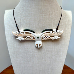 This is a wonderful New Zealand Jade and Bone necklace that can also be displayed as a sculpture with wooden stand.
