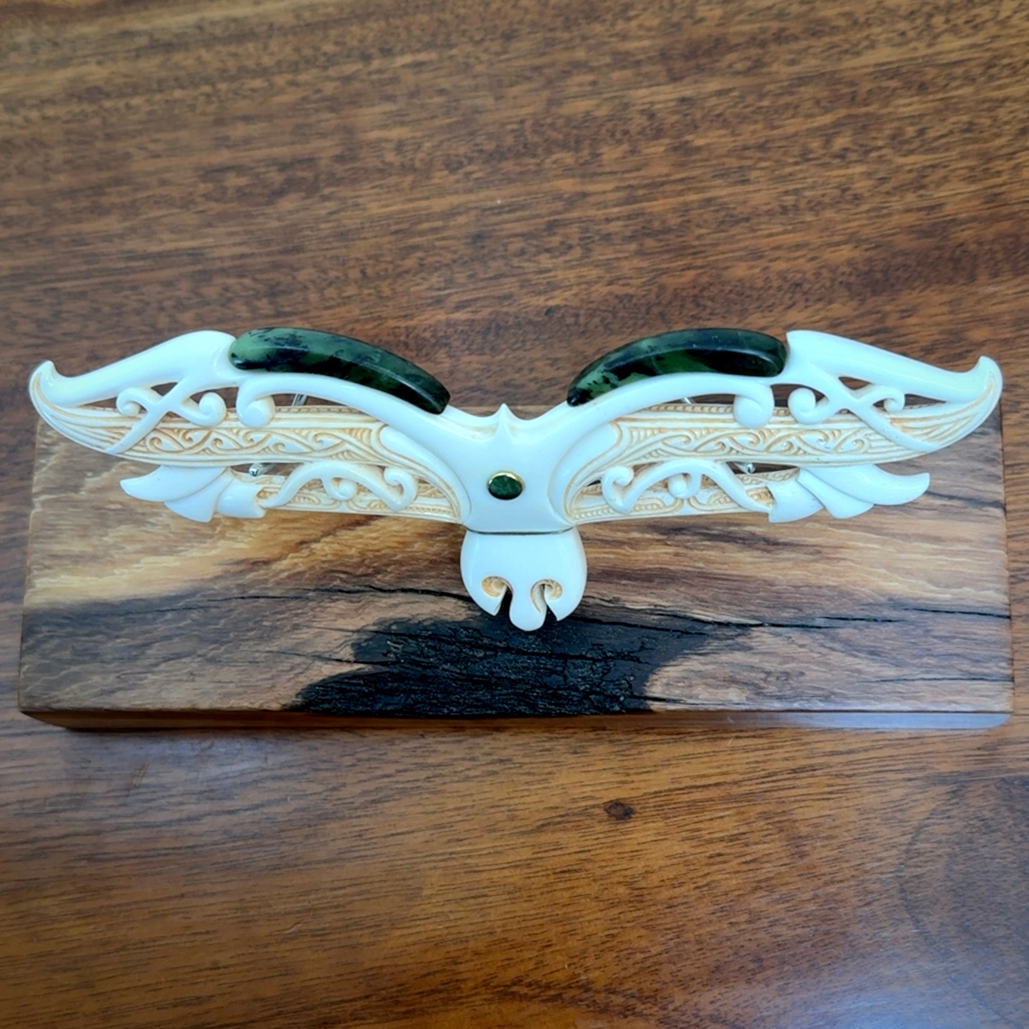 This is a wonderful New Zealand Jade and Bone necklace that can also be displayed as a sculpture with wooden stand.